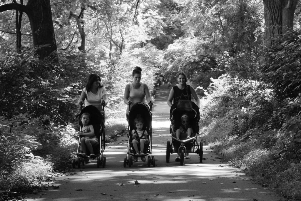 three women walking in the park, choosing the right stroller for your baby